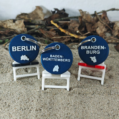 Vorderseite des TEGs 71-1 - Bundesland Baden-Württemberg 2026 im Liegestuhl mit Berlin und Brandenburg im Sand